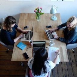 Woman sitting around a conference table in Tucson