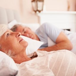 Worried Senior Woman Lying Awake In Bed