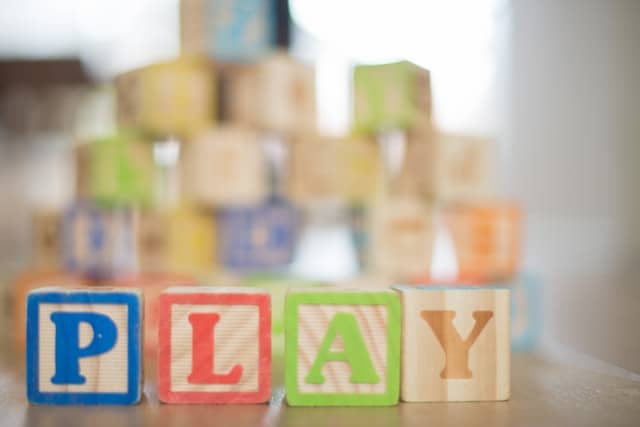 Child’s Toys Could Cause Hearing Loss The word play spelled out in block letters
