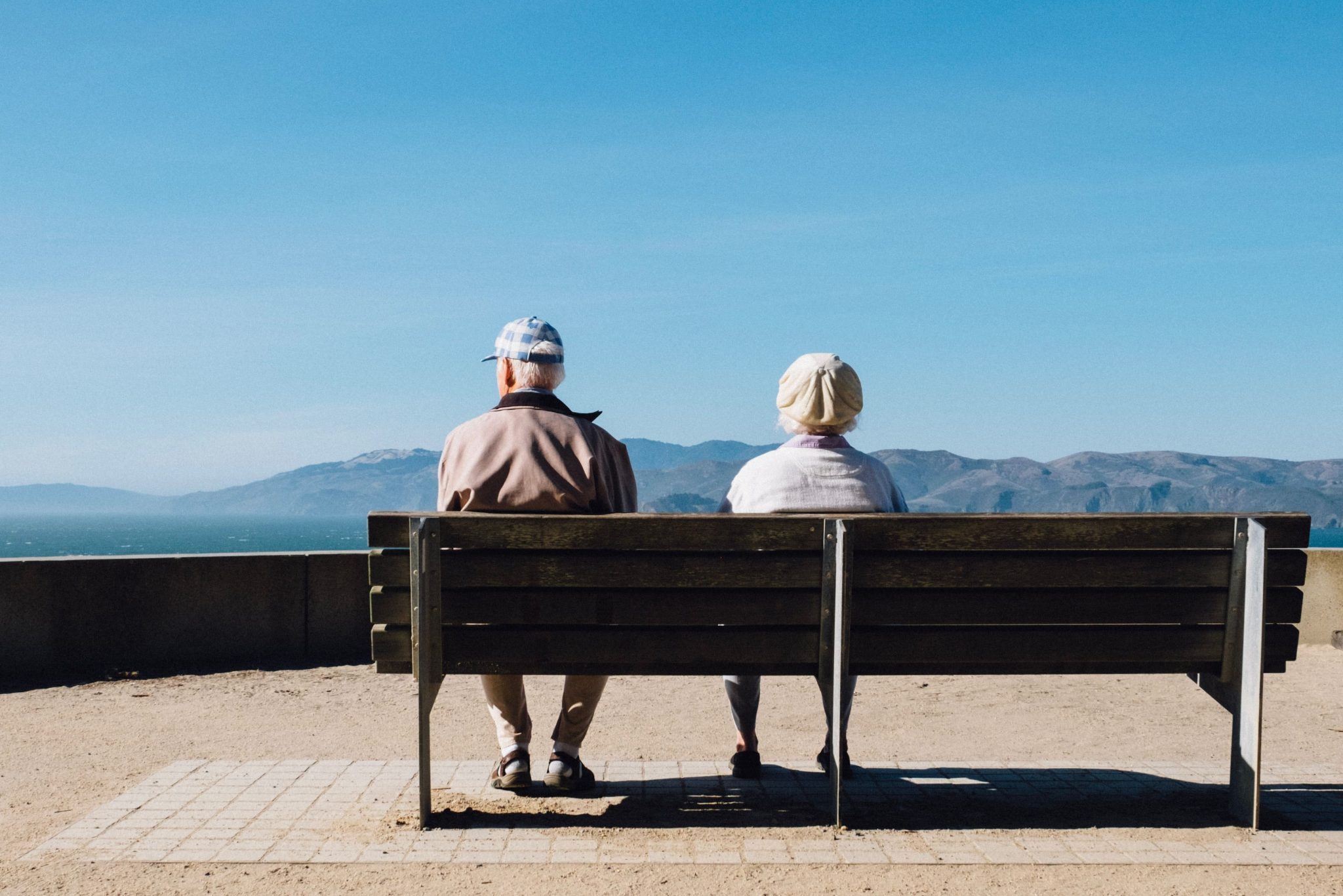 how hearing loss affects relationships older couple sitting on a bench