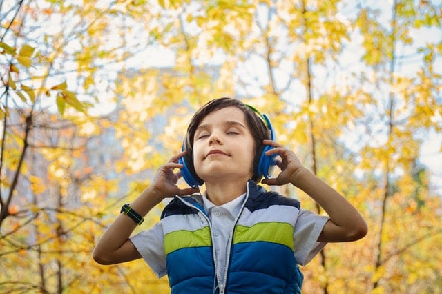 headphone misuse photo-of-a-boy-listening-in-headphones-1490844
