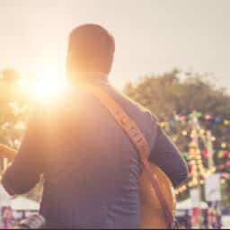 Musician playing at an outdoor festival.