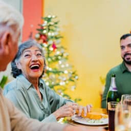 Family talking and eating during lunch on a holiday at home
