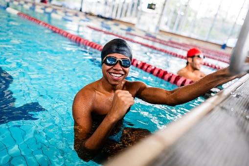 Portrait of a young man in the swimming pool.